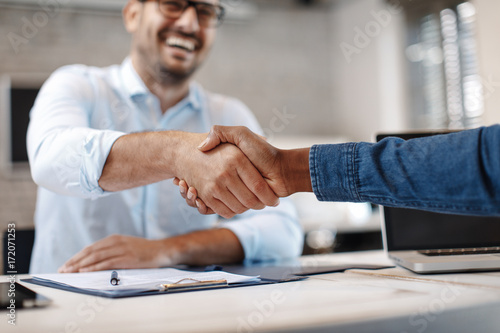 Close up of handshake in the office photo