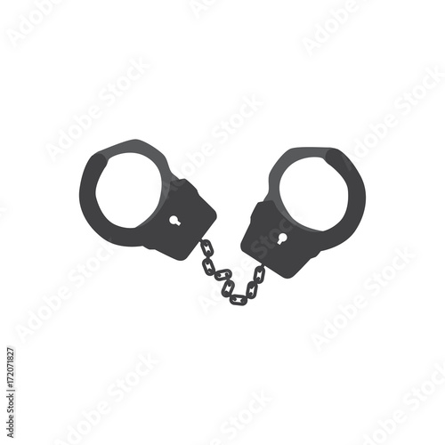 Metal handcuffs for detaining criminals. Outfit of a policeman