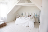 Couple Sleeping In Light And Airy White Bedroom