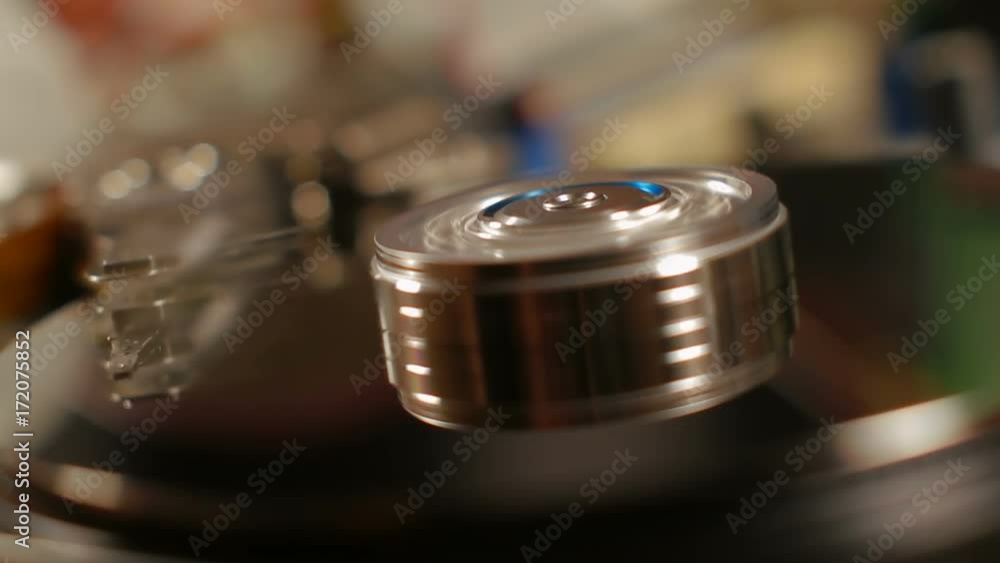 Spin up and operating hard disk drive on warm background Spin up and operating hard disk drive on warm background