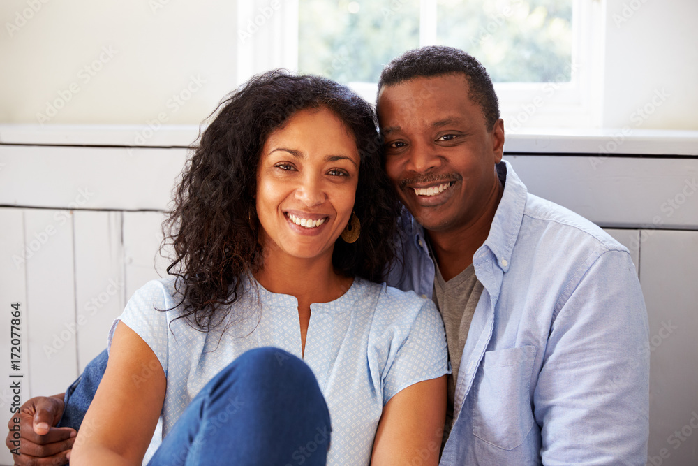 Portrait Of Romantic Couple Relaxing In Chair At Home Portrait Of Romantic Couple Relaxing In Chair At Home