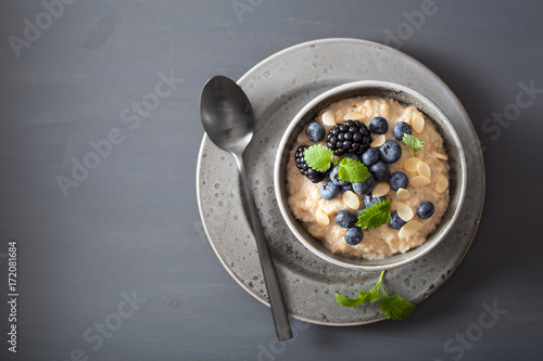 healthy breakfast steel cut oatmeal porridge with blueberry blackberry photo