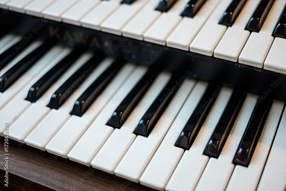 Double piano keys / keyboard. Closeup detail shot. Lens blur applied