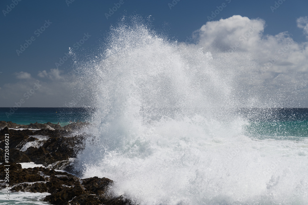 waves crashing over Snapper Rocks