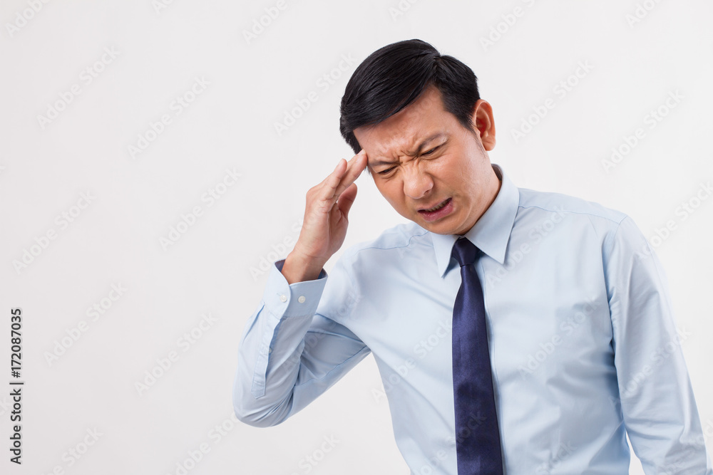 sick, stressed, overworked man with migraine headache sick, stressed, overworked man with migraine headache