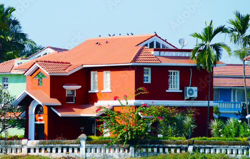 Bright colors. Blue house near the beach in Benaulim, South Goa, India. Big mansion.