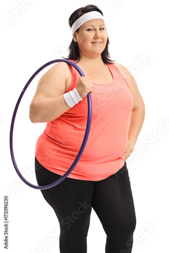 Overweight woman holding a hula-hoop © Ljupco Smokovski