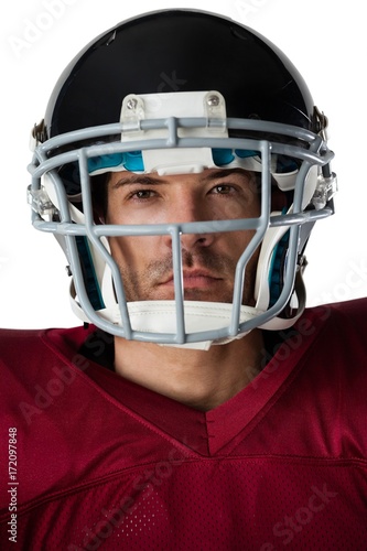 Portrait of American football player wearing helmet