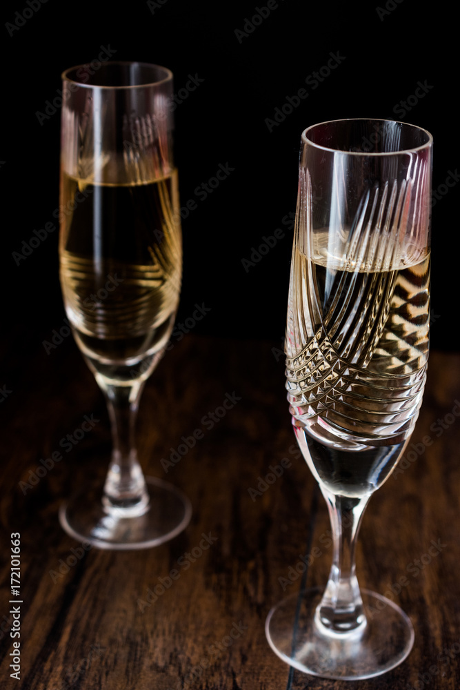 Champagne glasses on dark wooden surface. Champagne glasses on dark wooden surface.