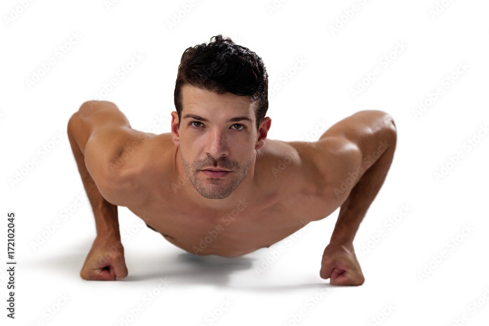 Portrait of determind shirtless player exercising planks Portrait of determind shirtless player exercising planks