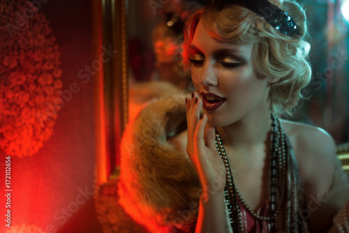 Retro portrait of a beautiful Gatsby woman. Vogue fashion style and smoke
