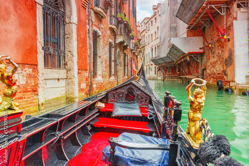Views of the most beautiful channels of Venice, front of the boat the gondola, floating along the canal.Italy.