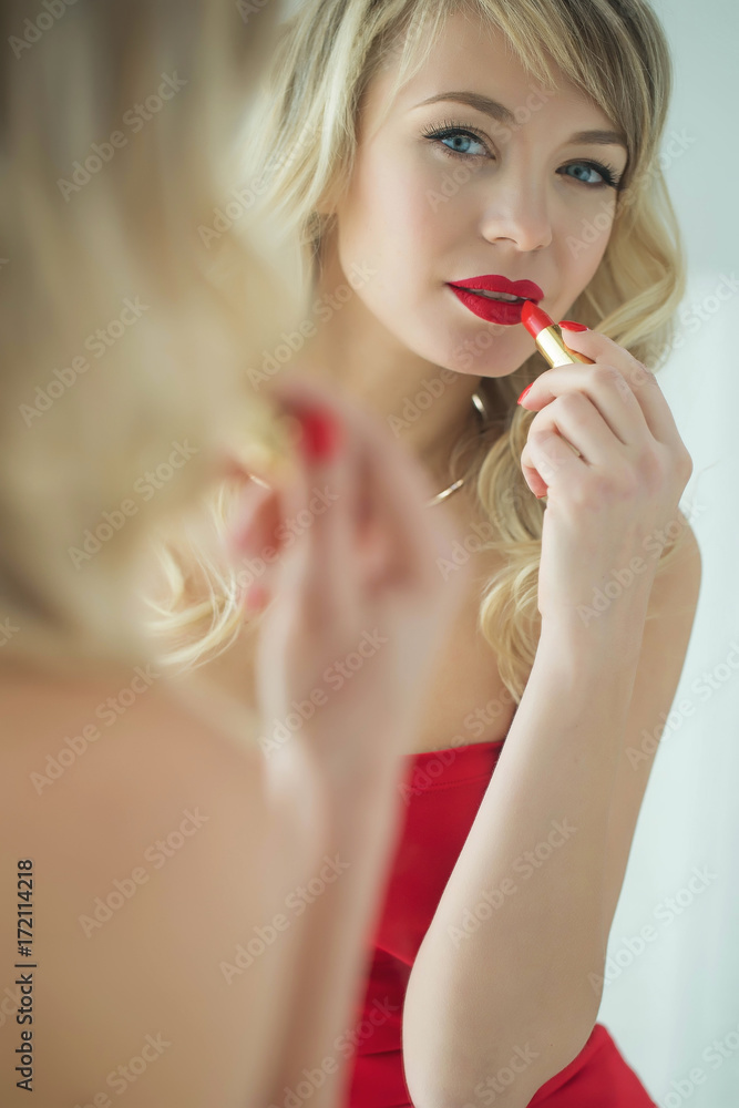 Woman doing makeup Woman doing makeup
