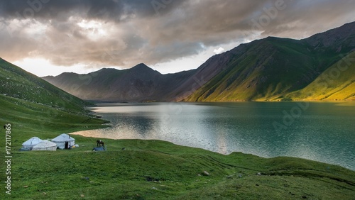 Sunset over yurt and mountain in Kyrgyzstan photo
