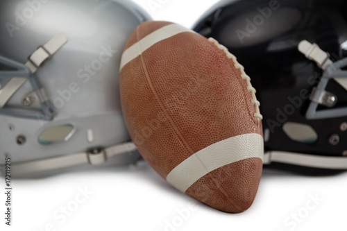 Close up of brown American football with sports helmet © WavebreakMediaMicro