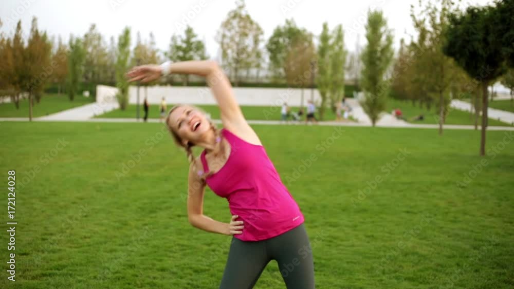 Sexy woman is engaged in fitness in the park. Sexy woman is engaged in fitness in the park.