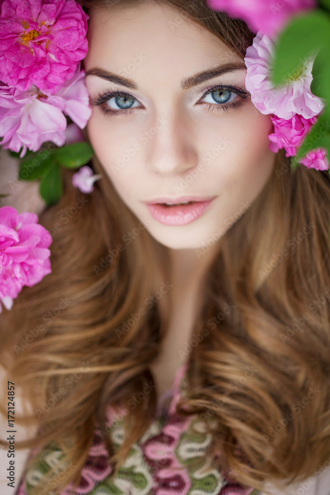 Beautiful woman in roses Beautiful woman in roses