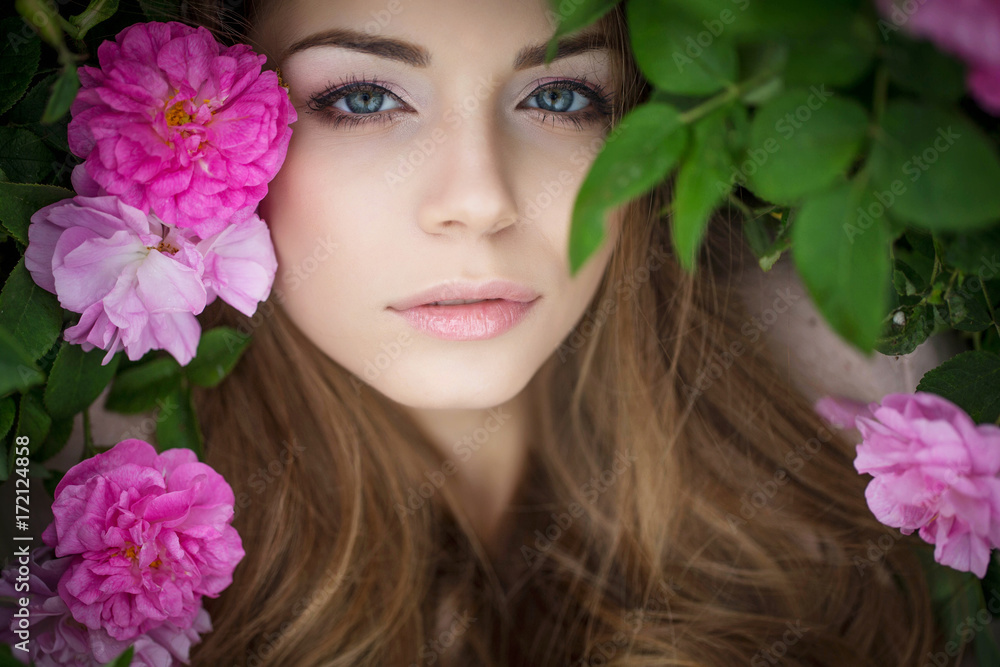 Beautiful woman in roses 