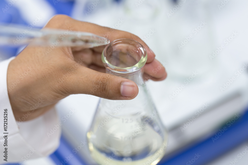 Experiment chemical solution mixing liquids on a Hotplate Stirrer in Lab. Experiment chemical solution mixing liquids on a Hotplate Stirrer in Lab.