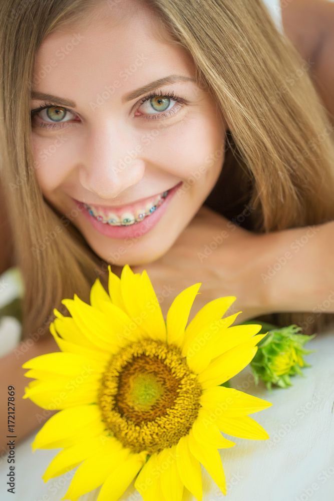 A woman is wearing braces 
