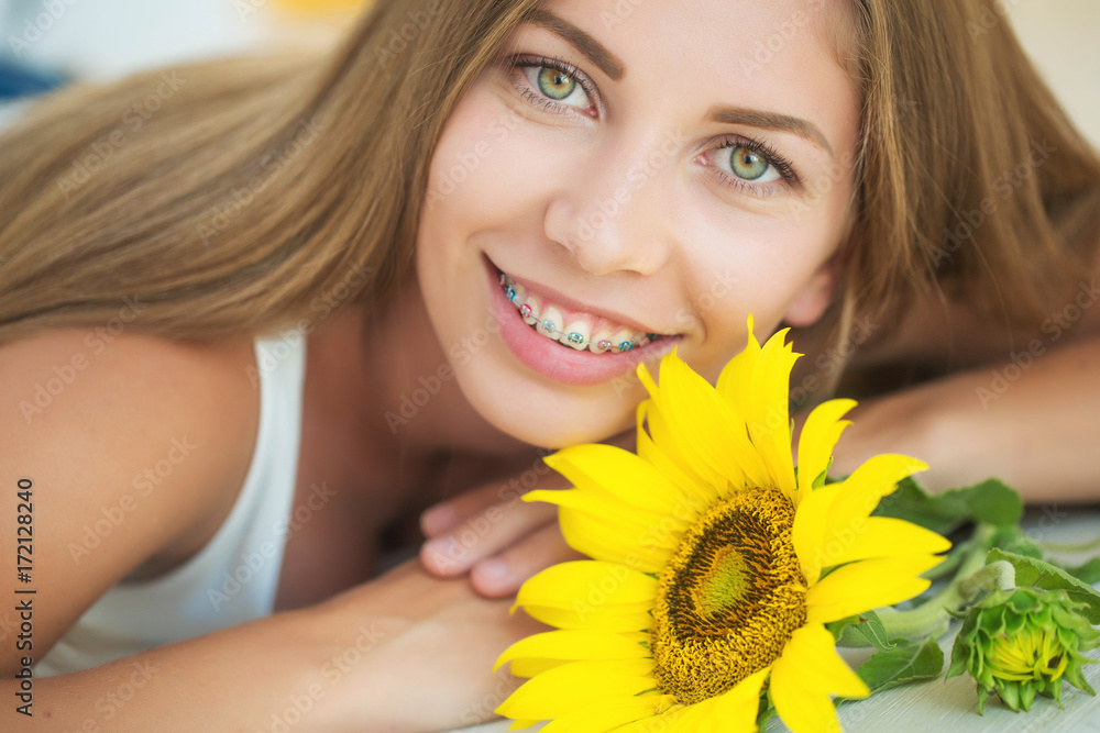 A woman is wearing braces 
