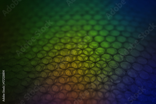 abstract background from plastic wrapper with colorful  dark light
