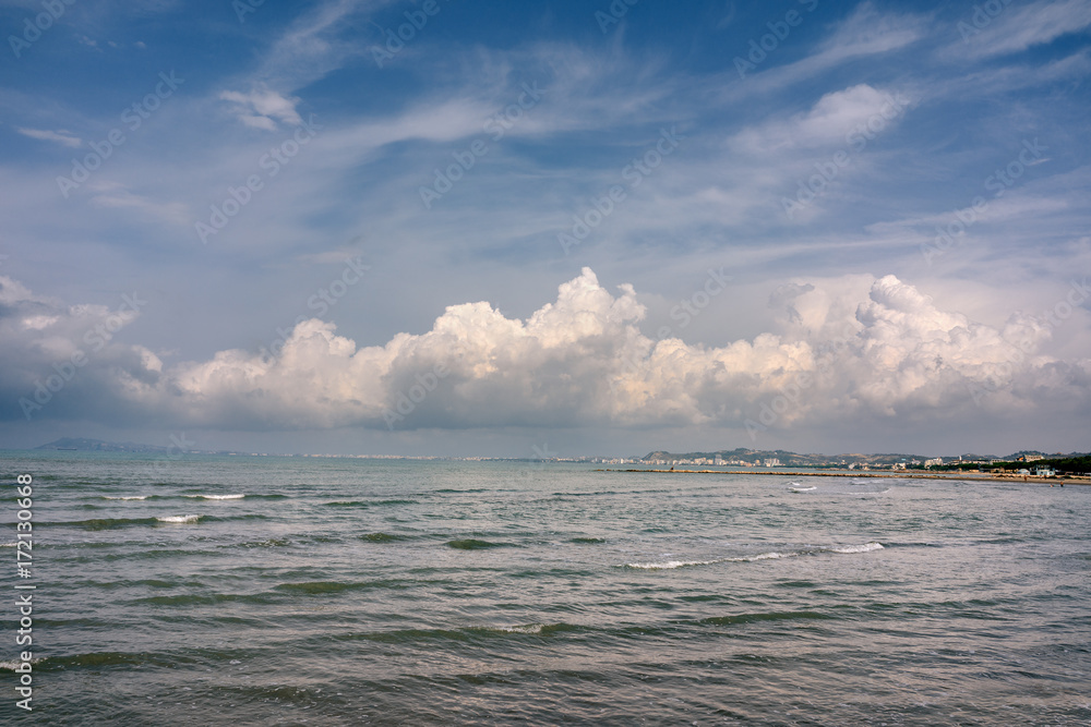 Fototapeta premium Albania. Golem. Seascape of the Adriatic Sea with cumulus clouds.