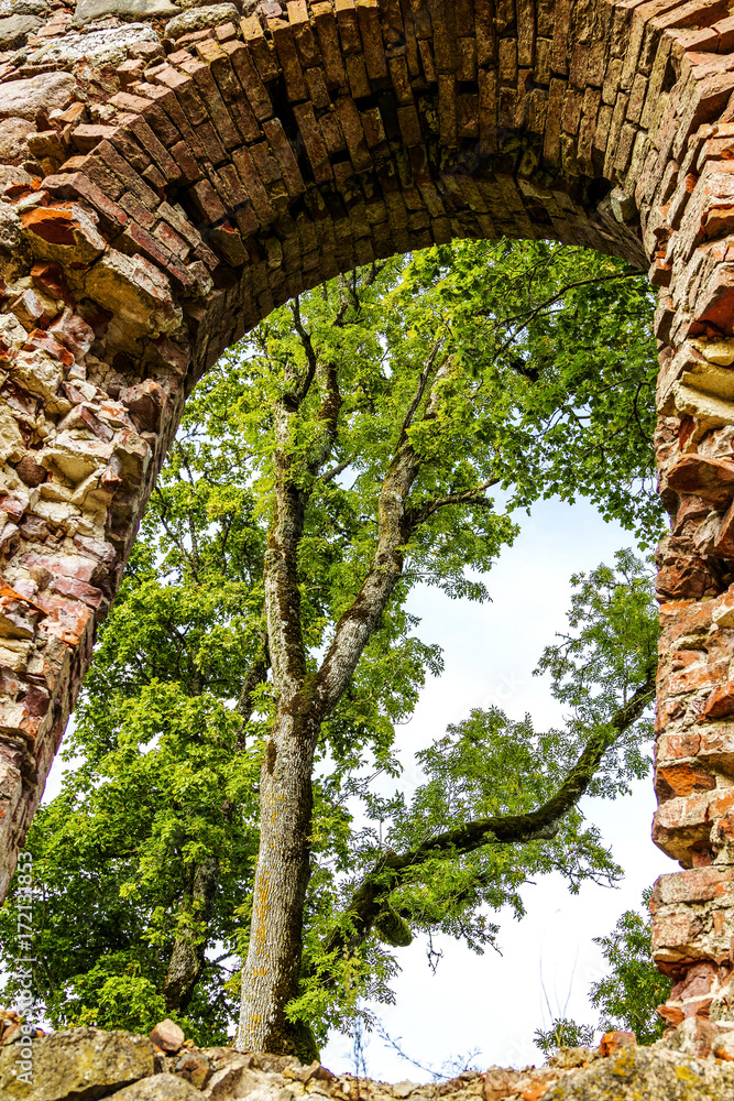 Fototapeta premium very old Kazdangas church wall of stones.