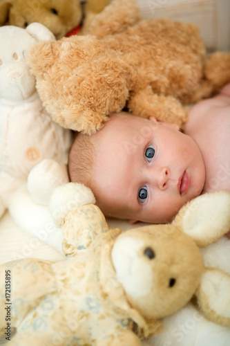 Childhood and innocence concept. Newborn toddler with blue eyes