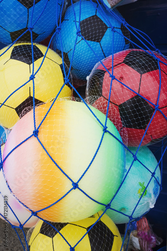 beach balls in a net photo