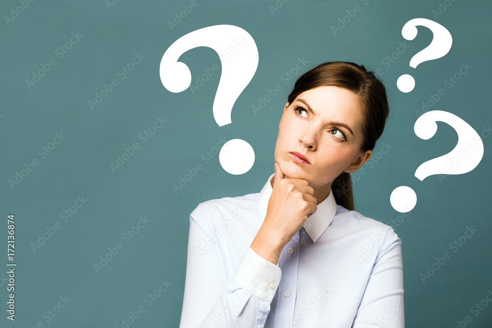 young woman with question marks. young woman with question marks.