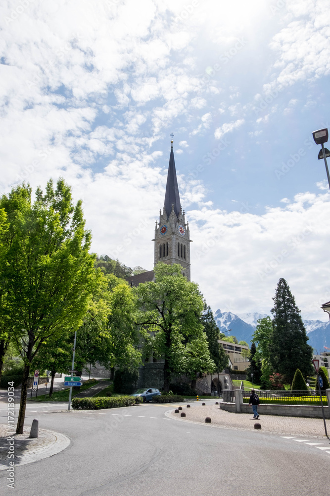 Vaduz Cathedral or Cathedral of St. Florin clock tower under the sun at Liechtenstein.
