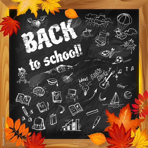 back to school background on dark blackboard witn doodles and autumn leaves