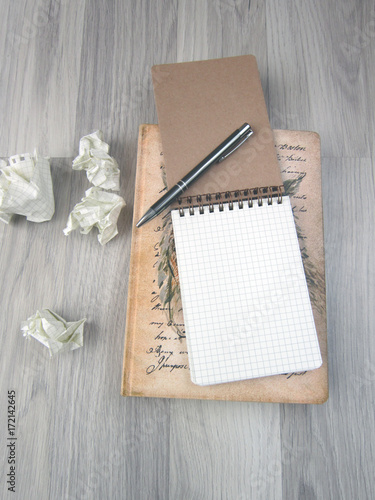Notepad and pen on the wooden floor,stationery