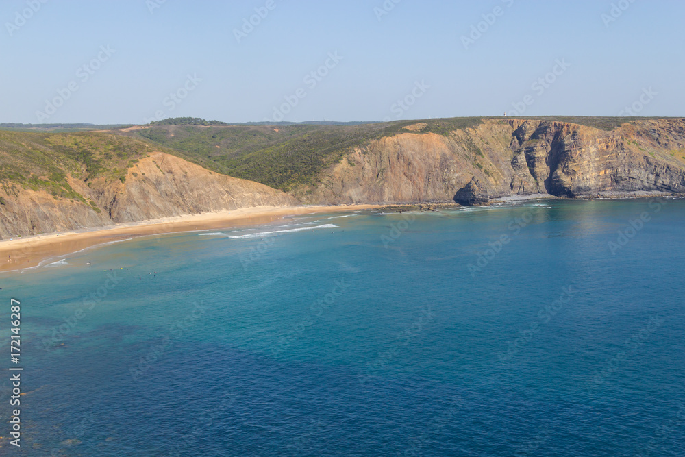 Fototapeta premium Cliffs, beach and waves in Arrifana