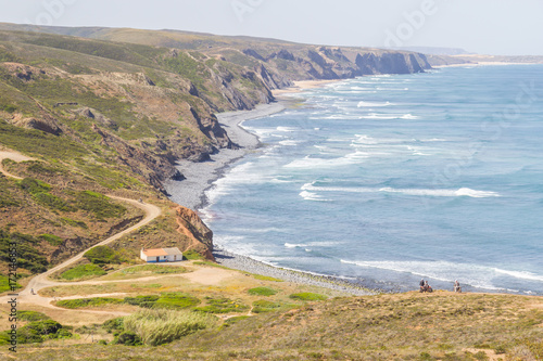 Cliffs, beach, mountains and vegetation in Canal beach