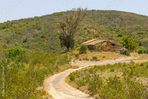 Trail and abandoned mud house in the mountain