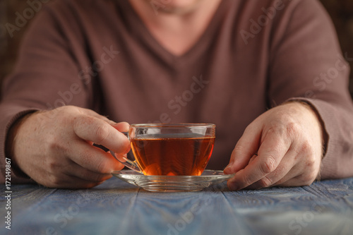 Male drink hot tea in cold day