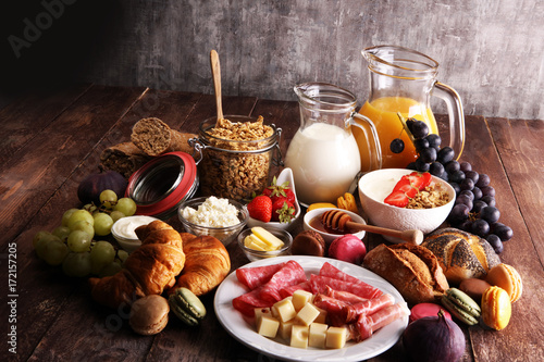 Breakfast served with coffee, orange juice, croissants, cereals and fruits. Balanced diet.