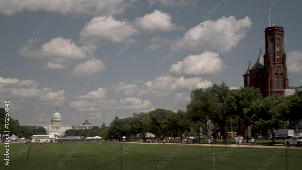 Steadicam shot of the US Capital panning to the Smithsonian Institution Castle Museum on a beautiful late spring day. Steadicam shot of the US Capital panning to the Smithsonian Institution Castle Museum on a beautiful late spring day.