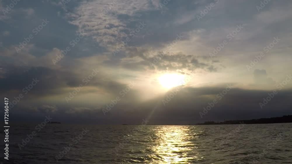 Time lapse of sea and the sky with the light of the sun shines down impact with the sea water in the evening. Time lapse of sea and the sky with the light of the sun shines down impact with the sea water in the evening.