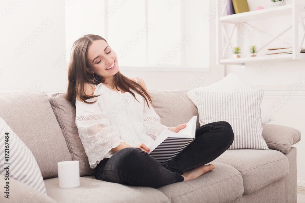 Young smiling woman reading her notes Young smiling woman reading her notes