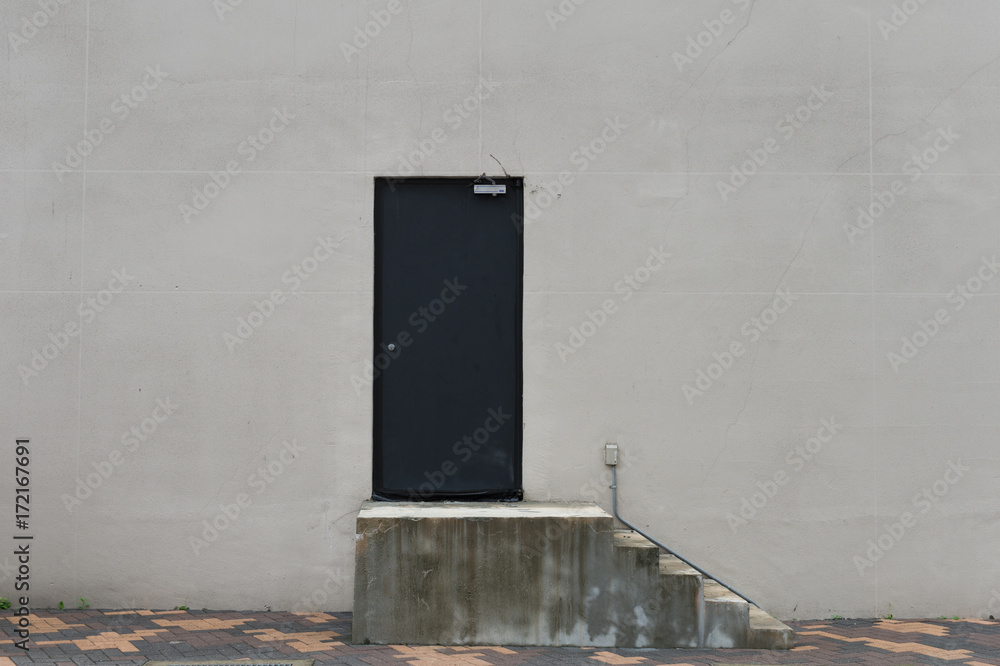 Fototapeta premium sidewalk by street wall & door