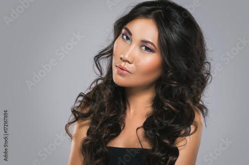 Young asian woman with a beautiful curly hair