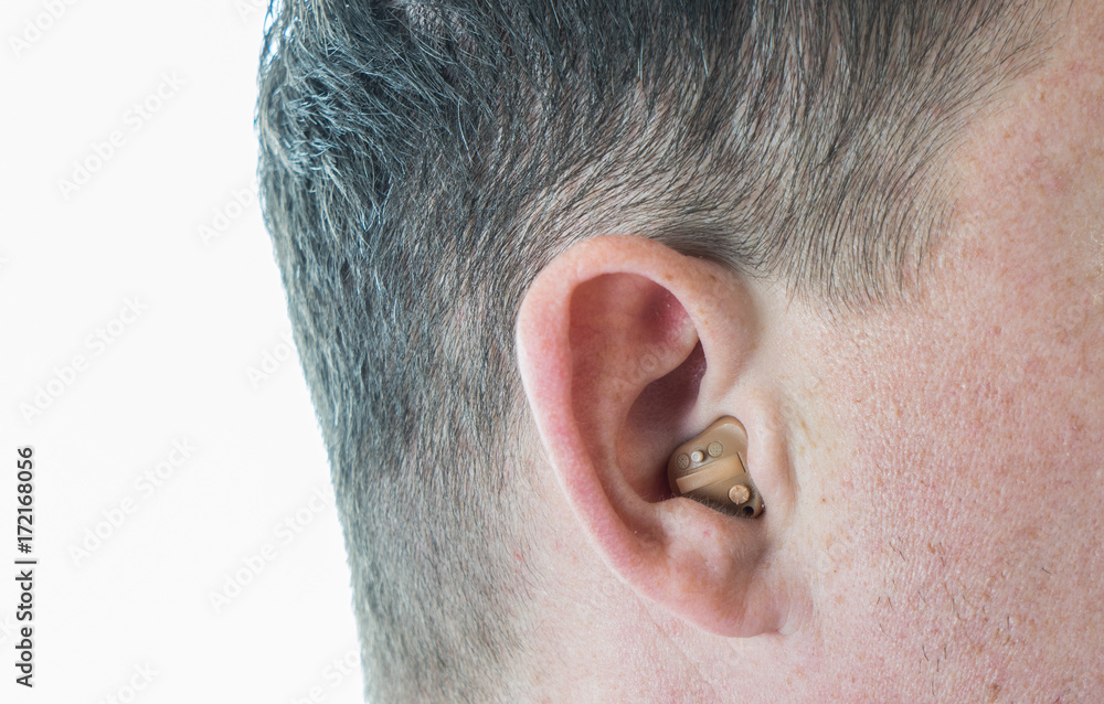 Man with hearing aid Man with hearing aid