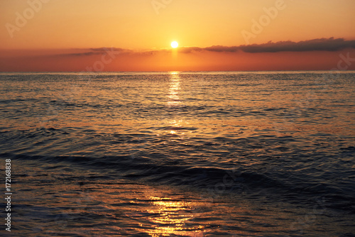 Colorful sunset over the sea from colliding waves. Nature composition