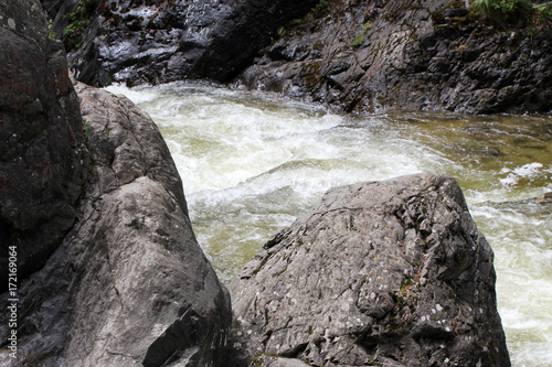 mountain river among large stones