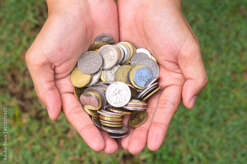 Close up coins in hand Close up coins in hand