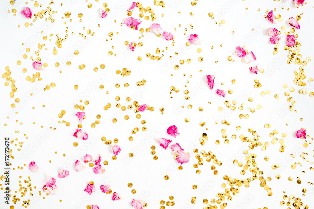 Colorful pattern made of pink rose petals and golden confetti on white background. Flat lay, top view. Colorful pattern made of pink rose petals and golden confetti on white background. Flat lay, top view.