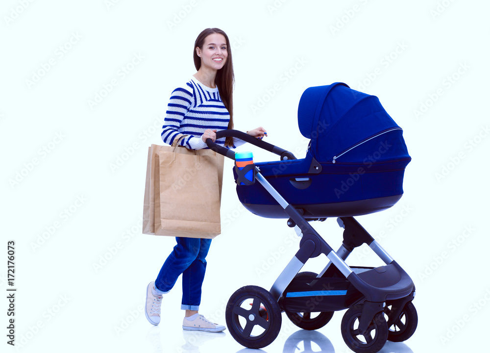 Full length portrait of a mother with a stroller, isolated on white background. Young mom Full length portrait of a mother with a stroller, isolated on white background. Young mom